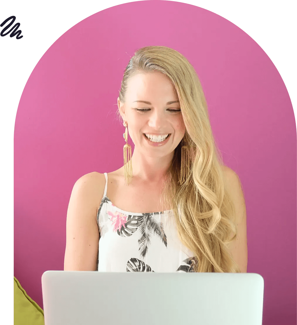 Woman is working with laptop, smiling